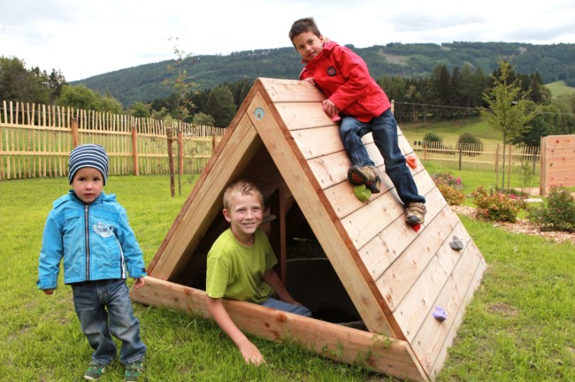Playing and climbing with friends on family vacations