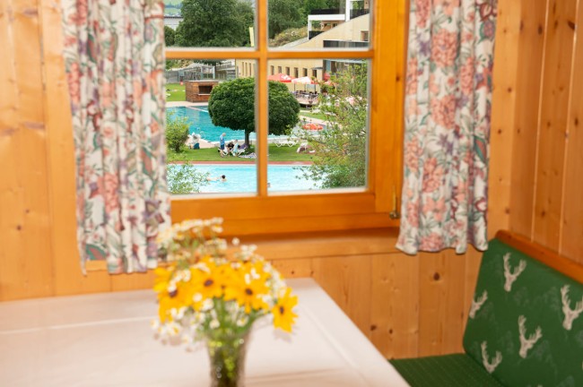 Dining table with window and view of the pool
